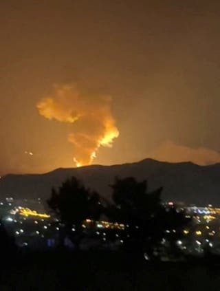Smoke rises in the direction of Khojir complex on 18 June 2025 as the Israel-Iran air war continues, in Tehran